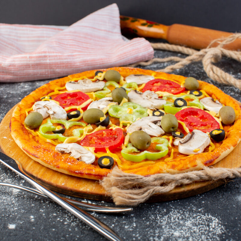 front-view-delicious-mushroom-pizza-with-tomatoes-olives-mushrooms-with-ropes-grey-surface