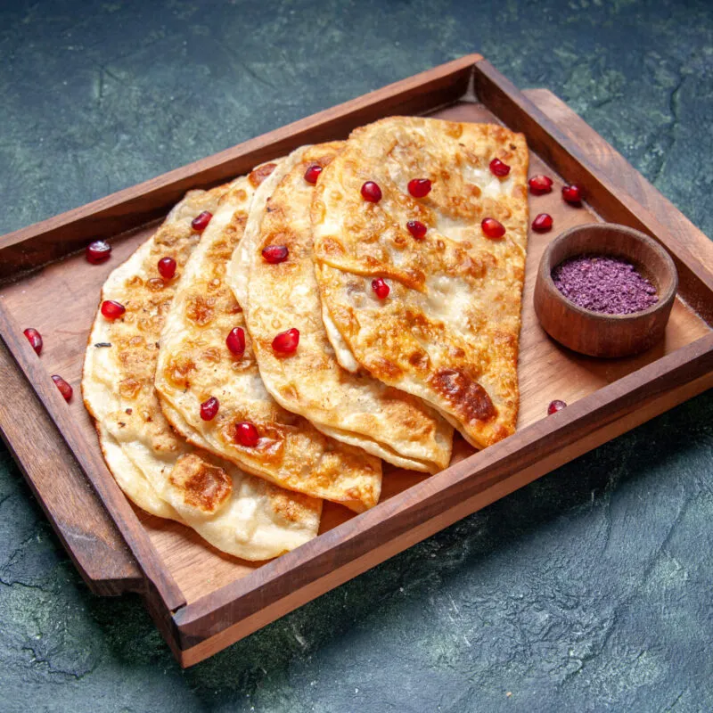 front-view-tasty-gutabs-thin-hotcakes-with-meat-inside-desk-dark-surface-scaled-300x300