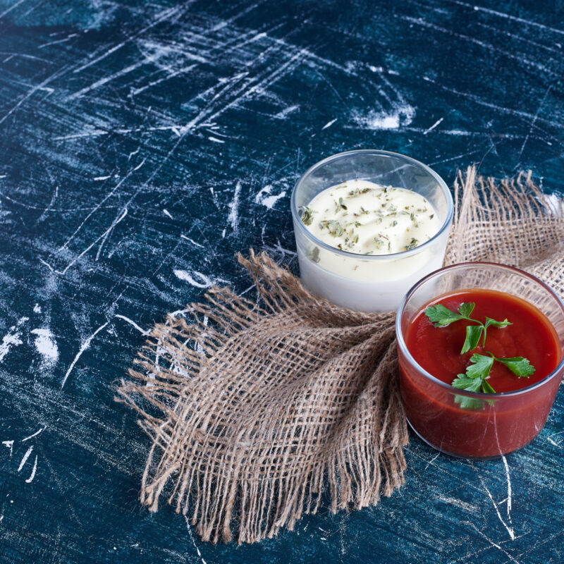 Mayonnaise and ketchup in glass cups