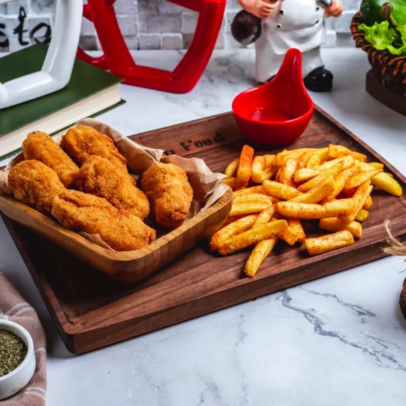 side-view-chicken-nuggets-with-french-fries-ketchup-board-scaled-300x300