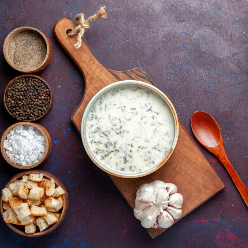 top-view-fresh-greens-inside-round-bowl-with-dovga-seasonings-rusks-dark-table-green-fresh-food-vegetable