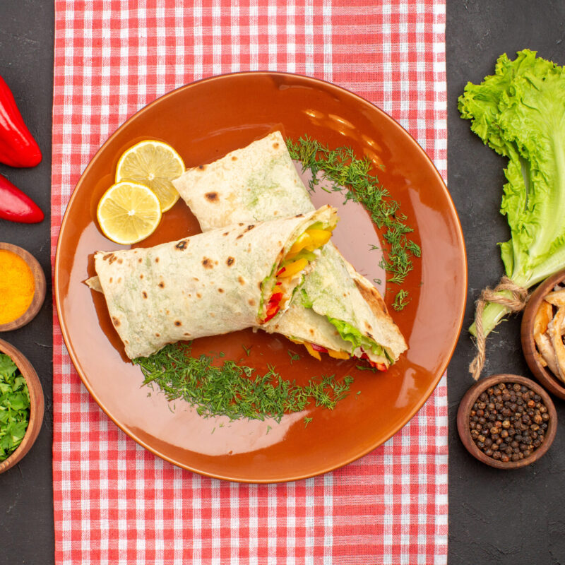 top-view-tasty-sliced-shaurma-salad-sandwich-with-greens-salad-dark