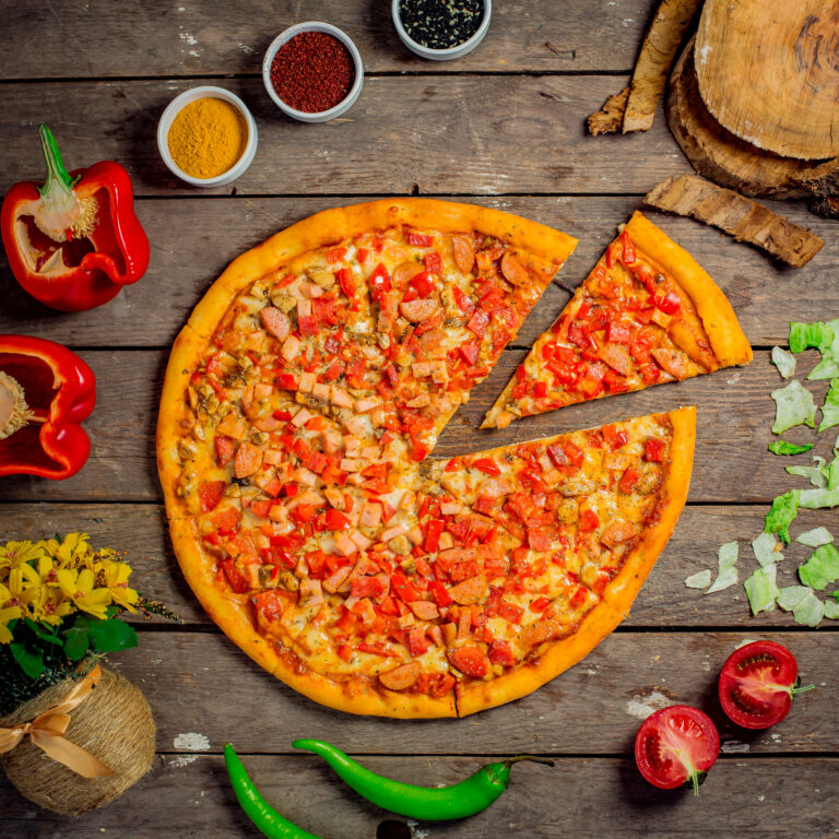 top-view-pizza-with-chopped-vegetables-mushrooms-sausages-sliced