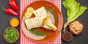 top-view-tasty-sliced-shaurma-salad-sandwich-with-greens-salad-dark